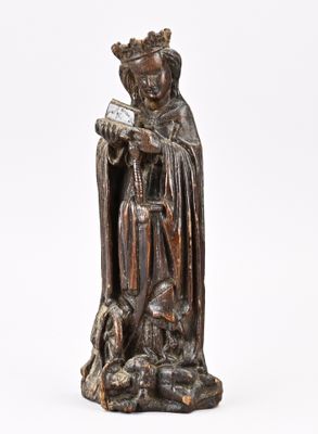 une statue en bronze représentant un homme tenant un livre et un chien
