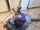 a vacuum that is sitting on the floor in the kitchen