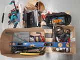 a box full of assorted tools on the floor