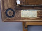 a close up of a wooden table with a label on it
