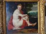a picture of a painting of a naked woman in a gold frame