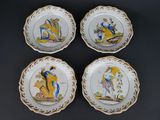 four plates with a picture of a man and a woman on them
