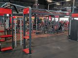 a gym with a lot of equipment in the room