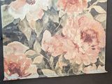 a picture of a painting of flowers on the wall