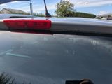 someone is taking a picture of the rear end of a car