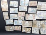 some old paper notes are arranged on a black surface