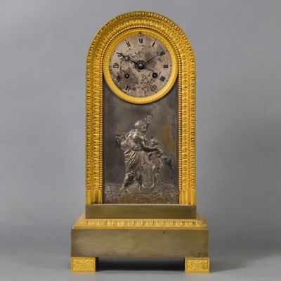 an image of a gold clock with a man on a horse
