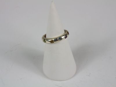 a close up of a ring on a cone on a white surface