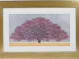 a painting of a tree with pink leaves in a gold frame