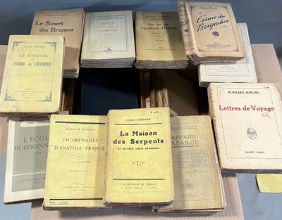several books are stacked on top of each other on a table