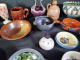 many different types of bowls and bowls on the table