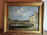 une peinture à l'huile représentant une fontaine devant un bâtiment, posée sur une table