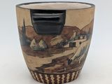 a picture of a cup with a painting on the inside of it