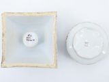 a small bowl and a small bowl on a white surface