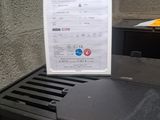 an image of a microwave with a receipt on top of it
