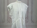 an image of a white shirt on a mannequin stand