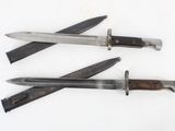 three different types of knives on a white surface