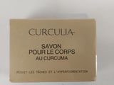 a close up of a box of soap on a white surface