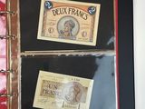 a picture of a book that has a picture of a french bank note on it