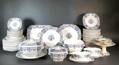 many different types of plates and bowls on the table