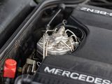 a close up of a car engine with the hood open