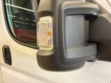 an image of a side view mirror of a van