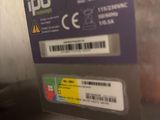 a close up of a metal box with a sticker on it