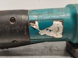 a blue drill with a hole in the middle of it