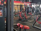 a large gym with a lot of machines in it