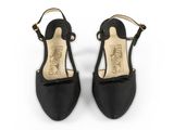 a pair of black women ' s shoes on a white background