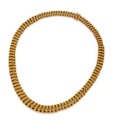 a gold chain necklace on a white background