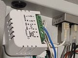 a close up of a control panel with wires attached