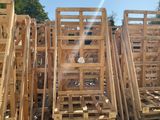 many wooden pallets stacked on top of each other