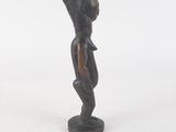 an image of a statue of a woman standing on a pedestal