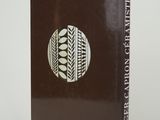 the front cover of a book with a picture of a plant in a circle