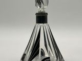 a close up of a glass bottle with a black and white design on it