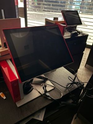 a desk with a laptop and a monitor on top of it