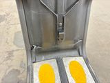 two yellow plates on the back of a metal chair