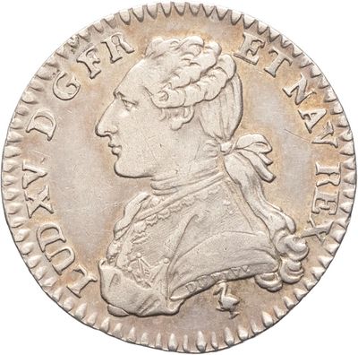 Gros plan sur une pièce d'argent portant une tête d'homme