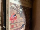 a book that is sitting in a box on a shelf