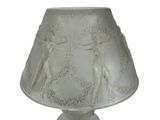 a lamp that has a white shade on it