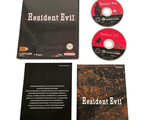 a dvd, cd, and booklet on a white surface