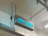 a sign that is hanging from the ceiling of a building