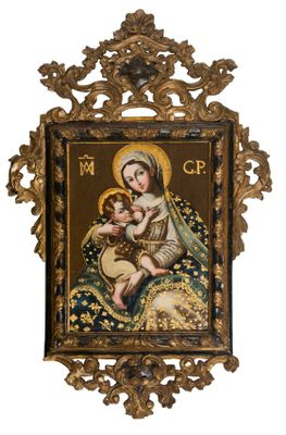 un cadre doré richement décoré, dans lequel se trouve un tableau représentant la Vierge à l'Enfant
