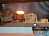 a room with a lot of furniture and a lamp in it