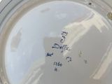 a white plate with a blue border on it