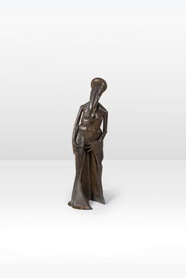 an image of a bronze statue of a woman holding a baby