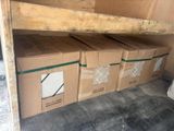 several boxes are stacked on top of each other in a room