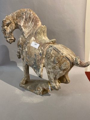 a statue of a horse that is sitting on a table