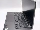 a black laptop with a black keyboard on a white surface